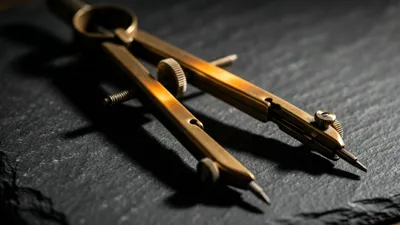 A brass drafting compass lies open on its side on dark slate, its knurled steel wheels and fine needle point visible, warm raking light along the arms casting straight shadows across the stone.